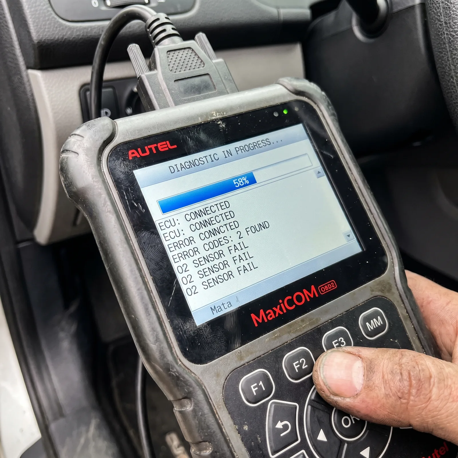 Manufacturer-specific diagnostic scanner being used to read vehicle codes